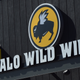 Illustration for article titled Nothing can separate hangry driver from her Buffalo Wild Wings—not even a parked carem/em